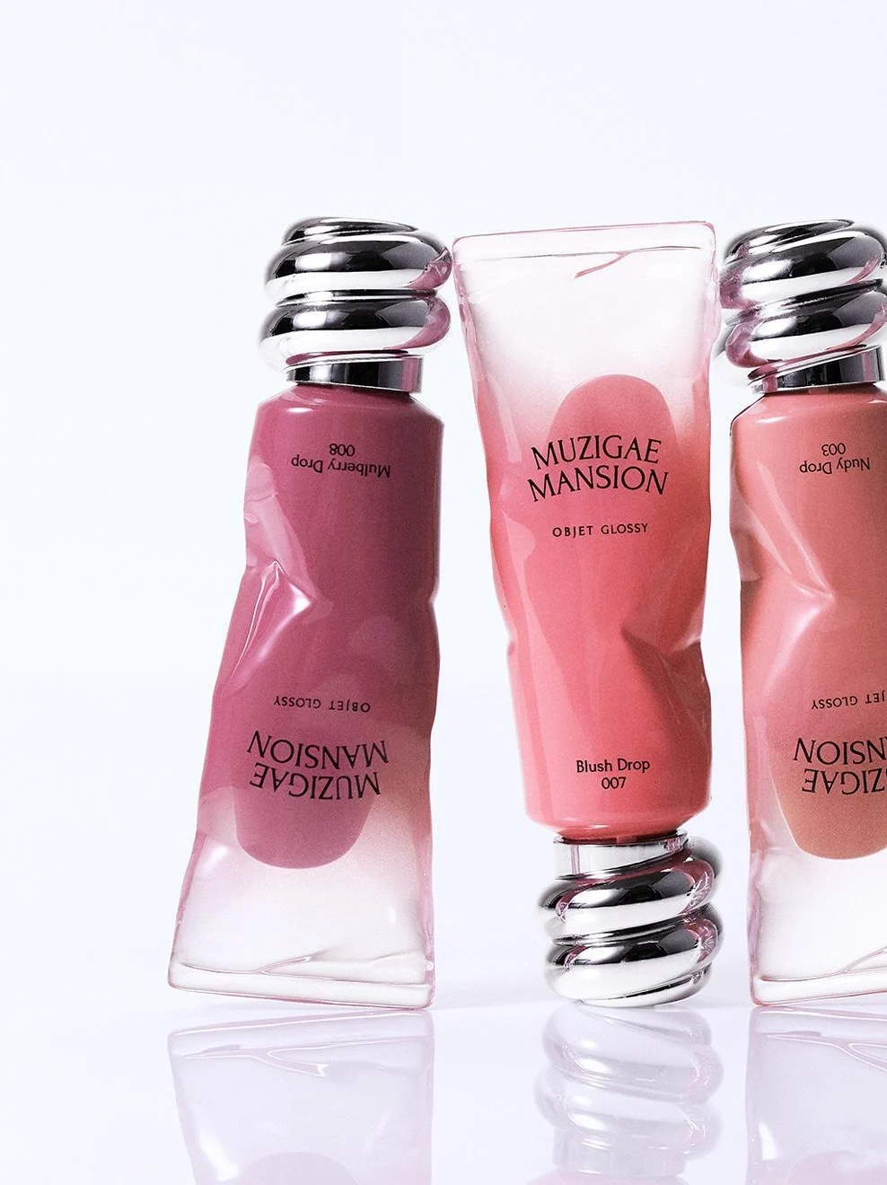 "meta_description": "Get vibrant 3D lips with MUZIGAE MANSION OBJET GLOSSY lip gloss. Experience long-lasting hydration and a natural tint.",