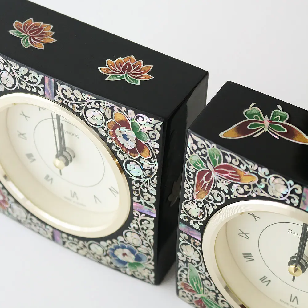 Mother-of-pearl table clocks with flower and butterfly inlay details