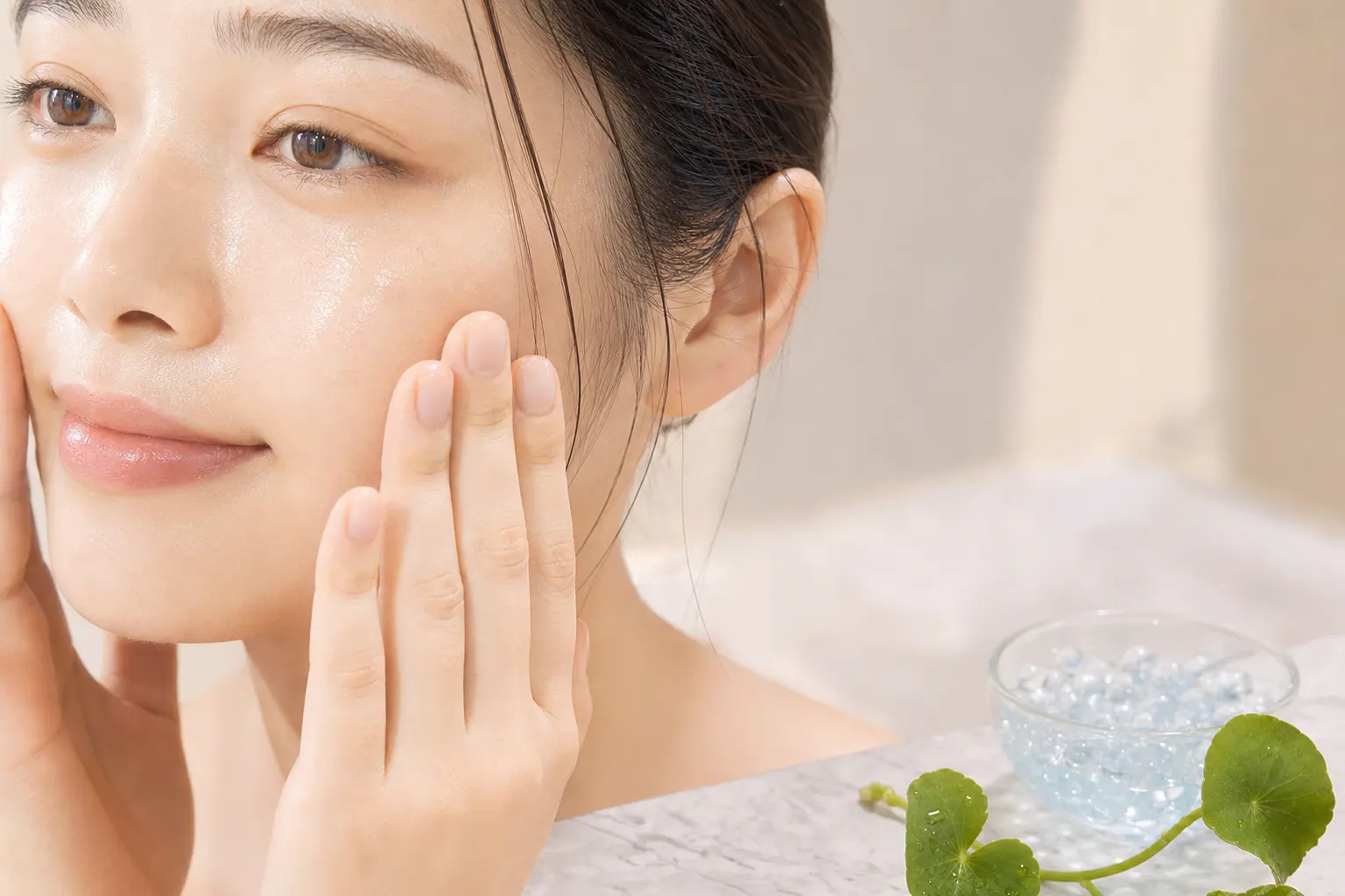 An in-routine close shot of hands patting liquid toner into skin: slightly dewy cheek, visible absorption, soft studio l